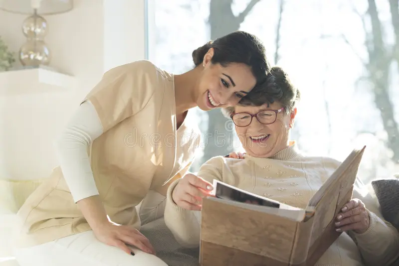 Caregiver sharing a laugh with a senior client