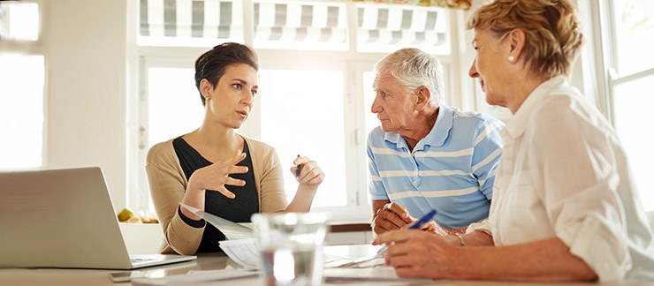 Caregiver greeting a senior client with a smile